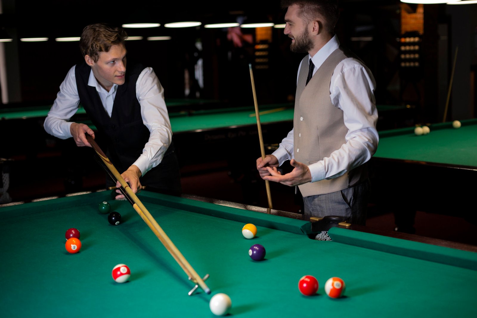 medium-shot-elegant-guys-playing-billiard